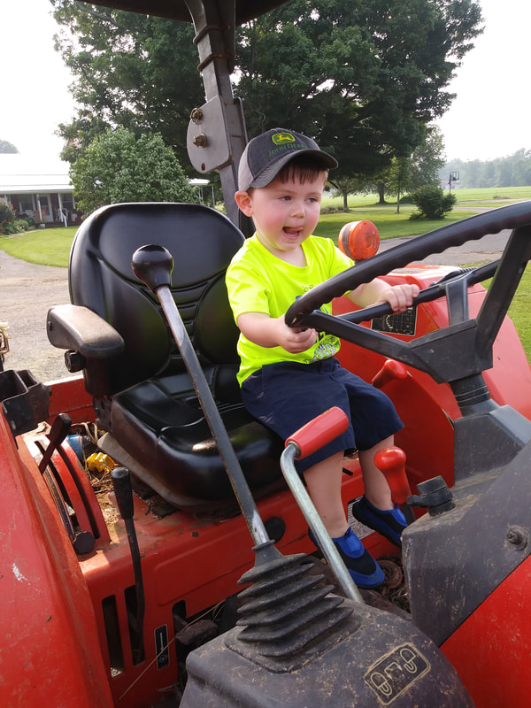 2021 Farm Week VanOrd Farm Visit boy on tractor